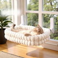 PawGlow plush window hammock with a cat sunning by the window
